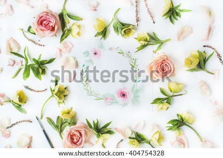 Watercolor painting, roses petals, yellow flowers and green leaves on white background. Flat lay, top view. wreath frame