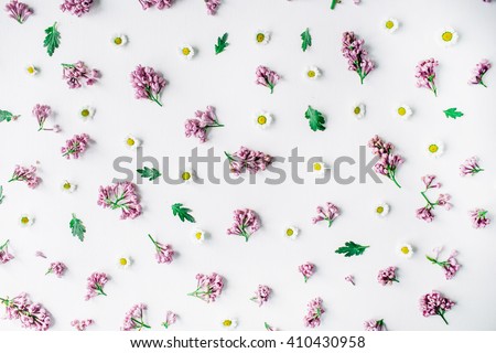 Pattern with lilac and chamomile white background. Flat lay, top view