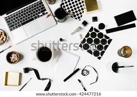 flay lay composition for bloggers, artists, magazines and social media. freelancer black style workspace with laptop, black coffee, sketchbook, napkins, ribbons, paintbrushes on white background.