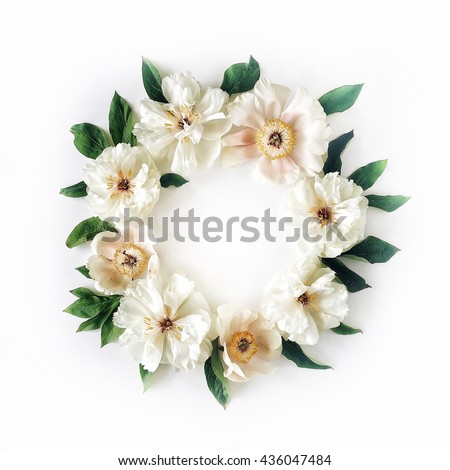 floral wreath frame with white peony flowers and green leaves on white background. Flat lay, top view