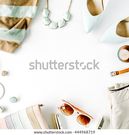 flat lay feminini clothes and accessories collage with cardigan, trousers, sunglasses, watch, bracelet, lipstick, mint high heel shoes, earrings and purse on white background.