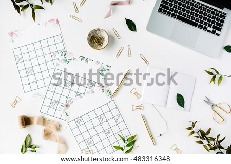 wedding planner schedule calendar painted with watercolor, laptop, notebook and accessories. flat lay workspace, top view