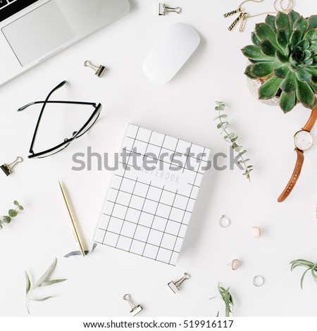 Flat lay, top view office table desk. feminine desk workspace with laptop, diary, succulent, glasses, watch on white background.