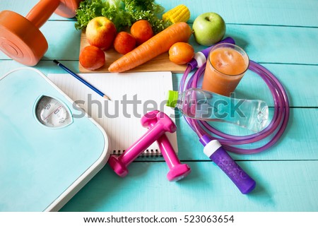 Healthy eating ,Workout and fitness dieting ,fitness and weight loss concept, fruit, Vegetable and water bottle,weight scale,on wooden background