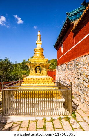 Gold stupa on the out of tmple wall. Taken in the Buddha top(Pusa Ding) temple. The Buddha top temple is one of Mount Wutai Temples. In the Qing Dynasty, the Buddha top temple was royal temple.