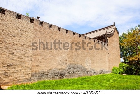 Chinese ancient house building and wall.Taken in the Chang\'s Manor Park of Yuci, Shanxi, China. In the park, there are a lot of Chinese ancient buildings that was Built in the Qing Dynasty.