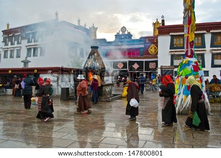 LHASA,TIBET/CHINA-MAY 6: Jokhang Temple and prayers on May 6,2005 in Lhasa, Tibet, China. The temple is located on Barkhor Square in Lhasa, is TibetÃ¢Â?Â?s first Buddhist temple.