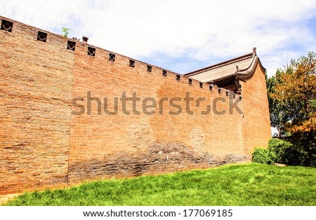 Chinese ancient house building and wall.Taken in the Chang's Manor Park of Yuci, Shanxi, China. In the park, there are a lot of Chinese ancient buildings that was Built in the Qing Dynasty.