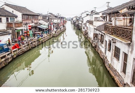 SUZHON, JIANGSU/CHINA-APR 11: Suzhou old town canals and folk houses on Apr 11,2015 in Suzhou, Jiangsu, China. Taken on the Shantang old street in Suzhou. Suzhou is a famous tourist destination.