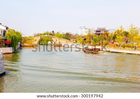 SUZHON, JIANGSU/CHINA-APR 12: Suzhou old town canals scene on Apr 12,2015 in Suzhou, Jiangsu, China. Suzhou is one of the old watertowns in China. It is a famous tourist destination.
