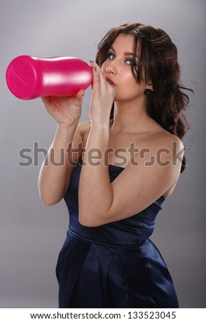Young woman and large drink