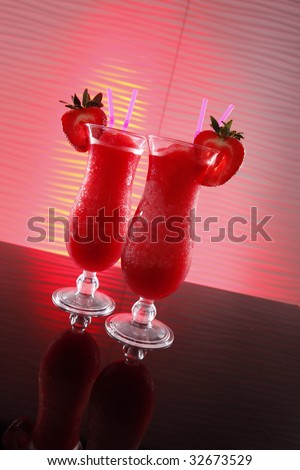 Strawberry daiquiri cocktail on wavy red may be an innocent smoothie if there\'s no alcohol in it