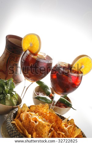 Sangria or fruit punch with tortilla chips and mole, poster format