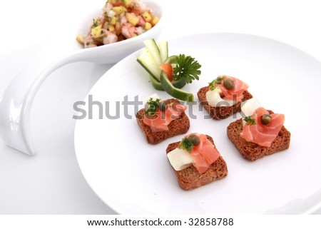 All bran mini toasts topped with smoked salmon and seafood salad