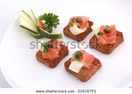 All bran mini toasts topped with smoked salmon and seafood salad