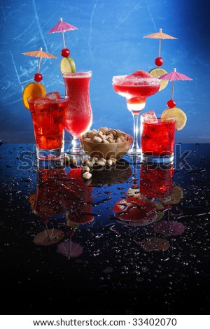 Strawberry Margarita and daiquiri, cosmopolitan on the rocks and Grenadine Fizz with pistachio