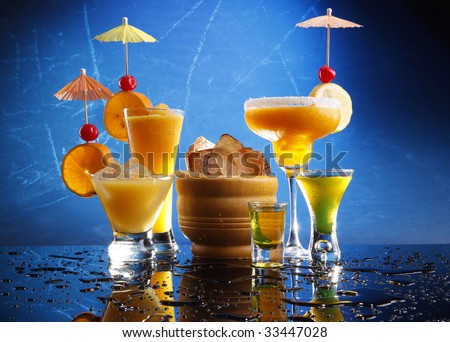 Orange party drinks on blue. Passion Daiquiri; Mango Margarita; Screwdriver and Shooters
