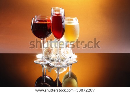 Two of each red, rose and white wine with roses