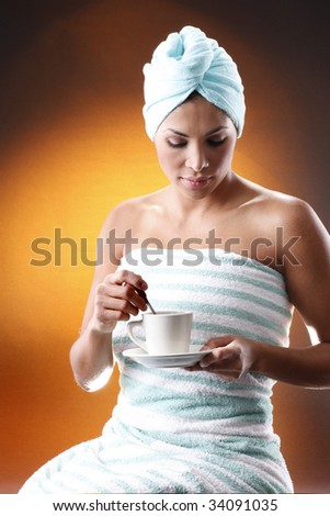 Young woman having a morning coffee. Meant to match Hot coffee, sisal sack and grains collection.