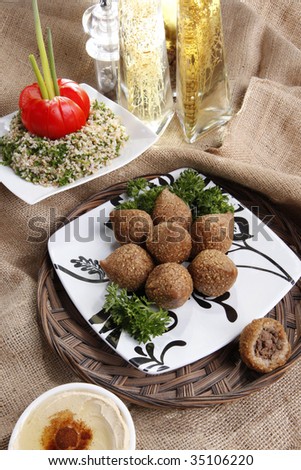 Middle eastern Fried Kibbe with Tabouli and Hummus Tahine