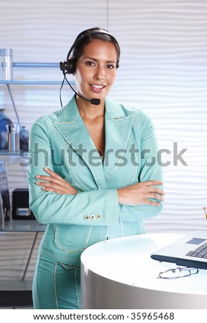 Customer support professional keeps records updated with a laptop