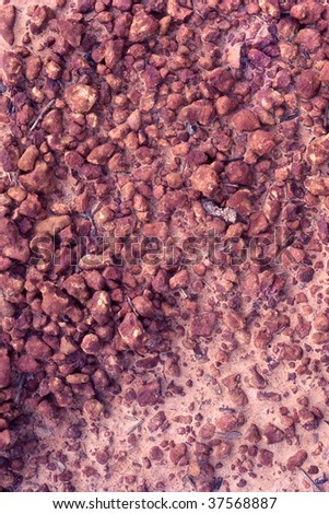 Gravel texture from a soil rich in red colored iron oxide