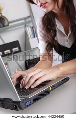 Young brunette at her contemporary office