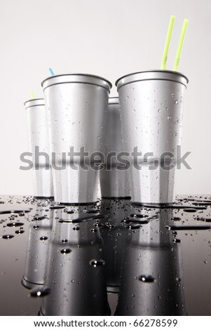 Cold silver soda plastic cups low view