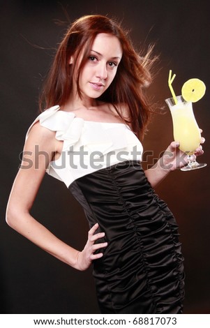 Cute redhead dressed to party with daiquiri cocktail