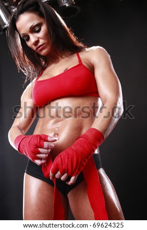 Body builder with boxing wraps