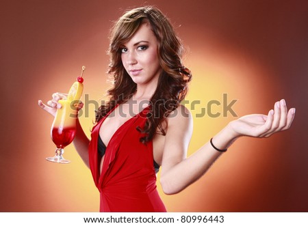 Striking woman in red and Tequila Sunrise cocktail