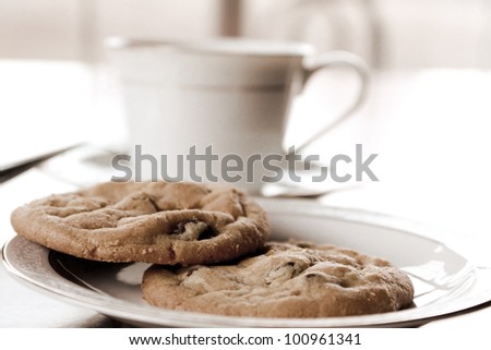 Cup and cookies done in vintage light