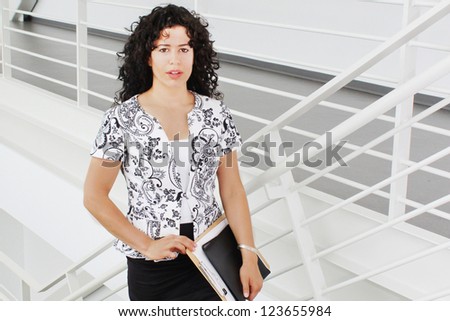 Business woman on stairs going up