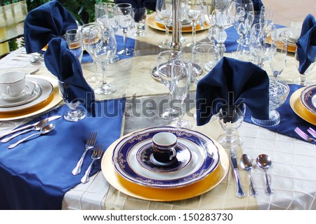 Blue and gold dishes set on a table