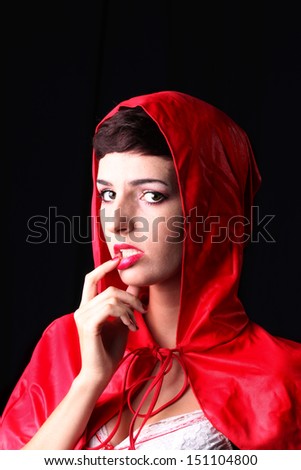 Sexy woman poses as a Red Riding Hood
