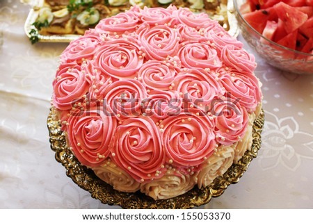 Large cake with pink and white roses and sugar drops