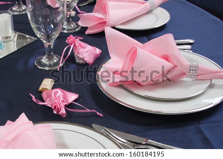 Pink Napkins And White Dishes On A Table, Ready For Guests