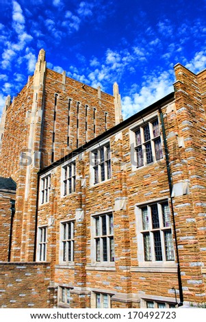 Large old building with bright blue sky at Tulsa University campus in Tulsa, Okla.