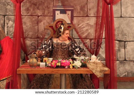MUSKOGEE, OK - MAY 24: Queen greets her guests at the Queen\'s Tea party at the Oklahoma 19th annual Renaissance Festival on May 24, 2014 at the Castle of Muskogee in Muskogee, OK