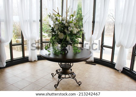 Pretty table and decorations in a wedding chapel
