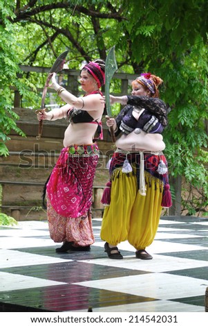 MUSKOGEE, OK - MAY 24: Dancers dressed as Gypsies dance during Oklahoma 19th annual Renaissance Festival on May 24, 2014 at the Castle of Muskogee in Muskogee, OK.