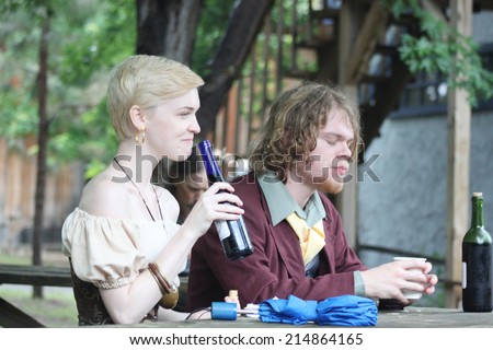 MUSKOGEE, OK - MAY 24: A couple of festival goers enjoy a drink during the Oklahoma 19th annual Renaissance Festival on May 24, 2014 at the Castle of Muskogee in Muskogee, OK
