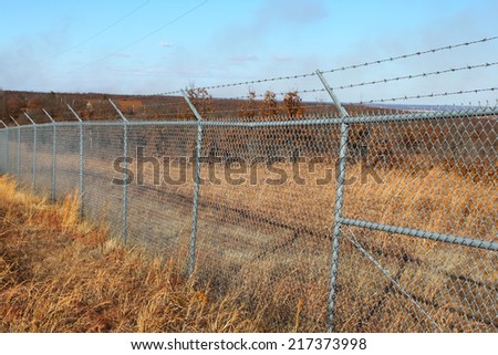 Field with a large wire fence