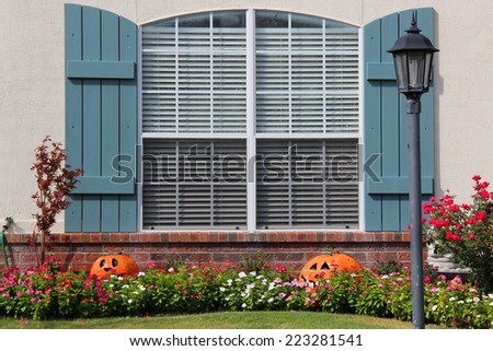Fall decorations near a window of a single-family house