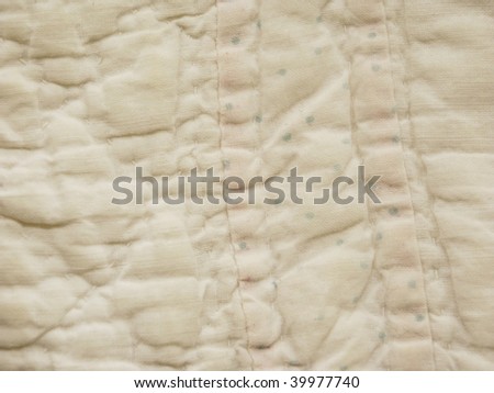 White handmade quilt detail
