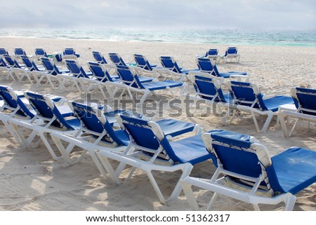 Lounge chairs near ocean