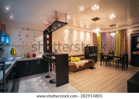 Cozy apartment in beige tones. Room Facilities Studio. Kitchen with dining room. interior, apartment, wall clock, design, architectural design, style, color, yellow, blue, ceiling, floor
