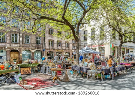 STRASBOURG, FRANCE - APRIL 16: FLEA MARKET IN THE TOWN CENTER. Strasbourg\'s historic center with a flea market on the square APRIL 16, 2014 2014 in Strasbourg, France.