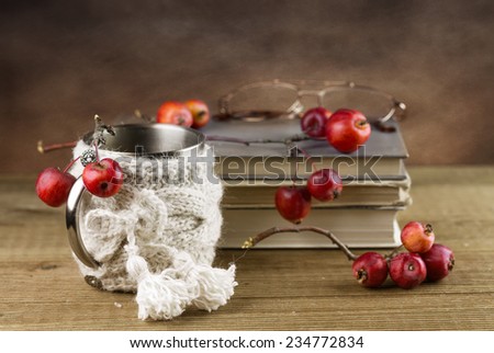 Still-life with books and paradise apples