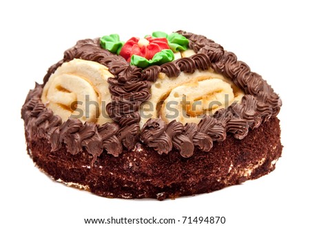 Chocolate cake with cream-colored roses. Isolated on white background.
